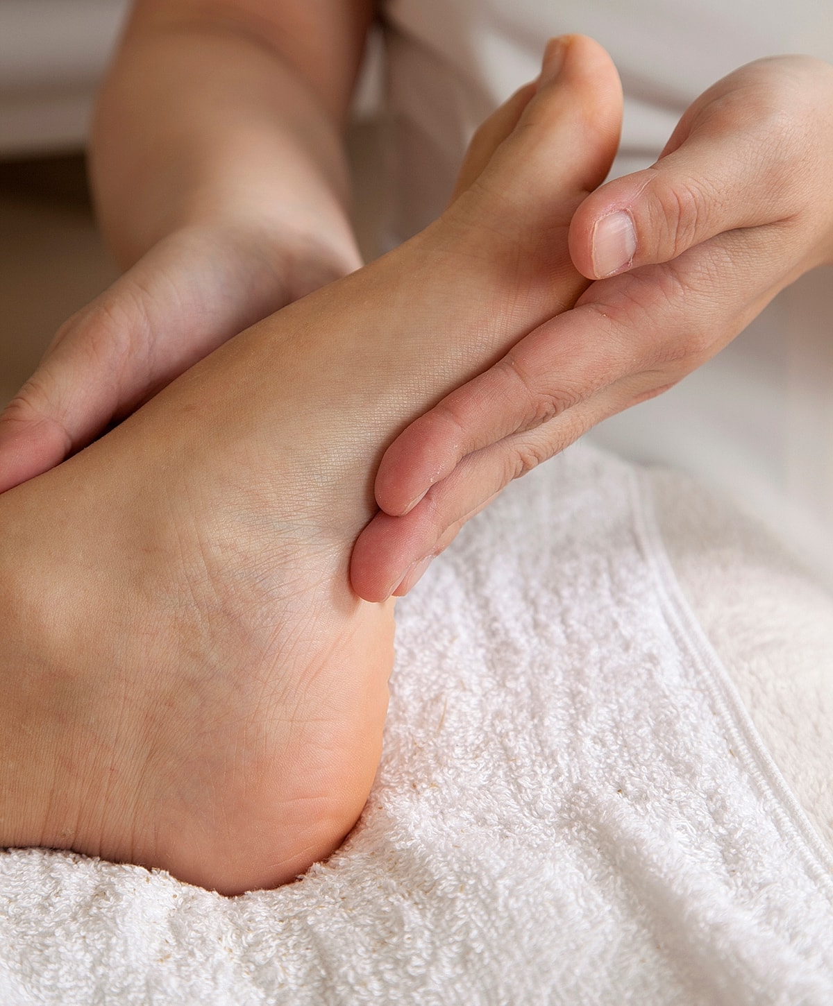 Foot massage during a spa treatment session.